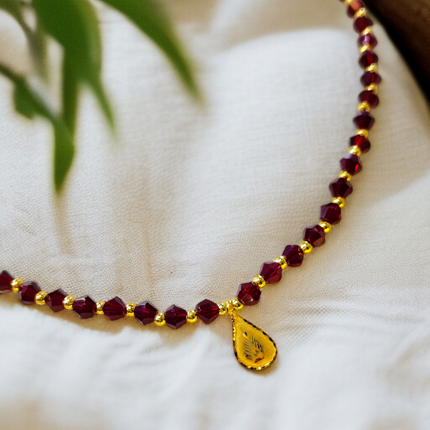 TRJ WGT: 0.140 GM APPROX KDM GOLD DROP DESIGN LOCKET 1 PIECE WITH MAROON CRYSTAL ADJUSTABLE TASSEL FOR GIFT PURPOSE (50 TONCH).