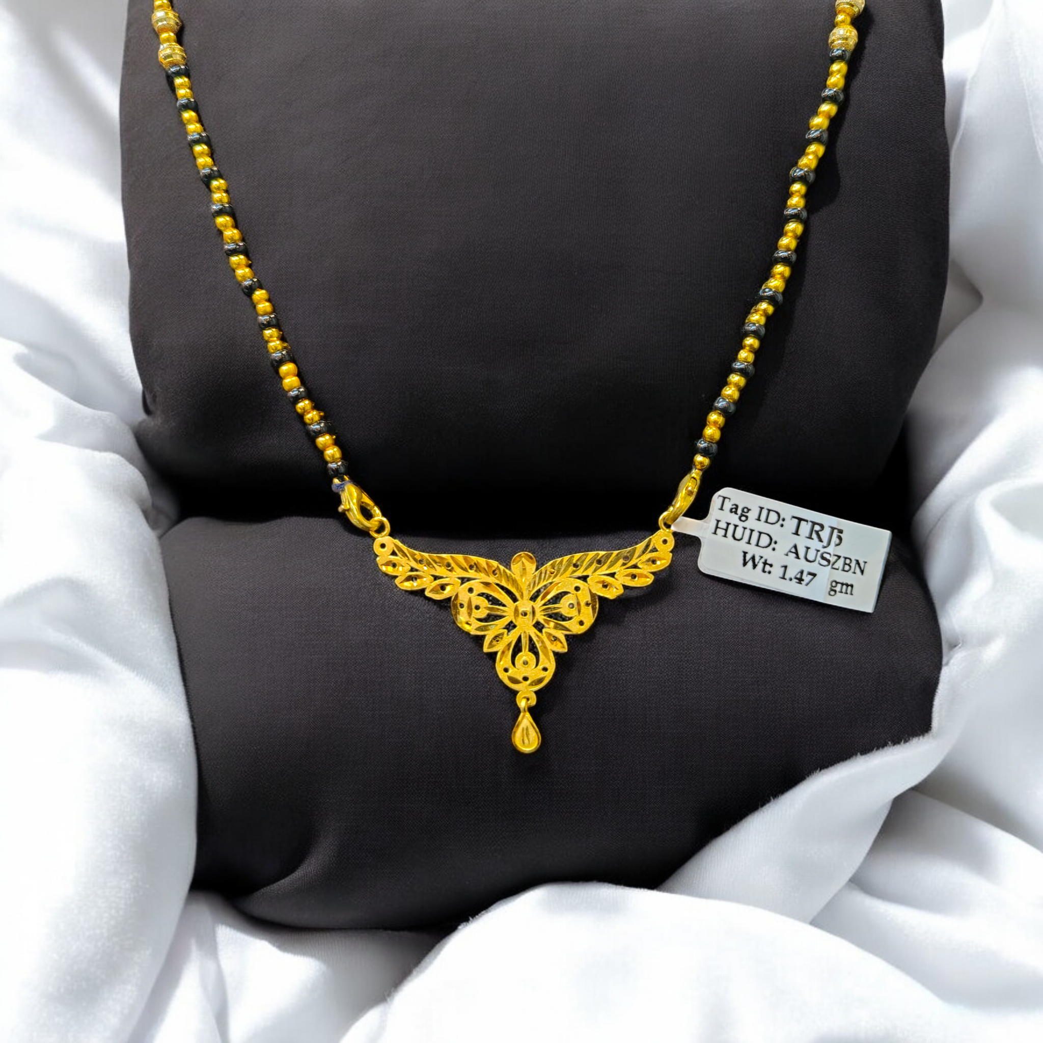 (GPM) TRJ WGT: 1.470 GM APPROX 22KT HUID HALLMARK GOLD PENDANT MANGALSUTRA 1 PIECE WITH TASSEL.