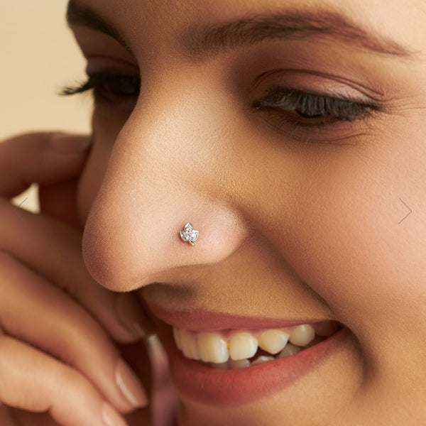 NOSEPIN- RAJLAXMI DIAMOND JEWELLERY - WGT: 0.185 GM - NATURAL DIAMOND (0.06 CENT) HUID HALLMARK 18KT DIAMOND NOSEPIN FOR WOMEN WITH CERTIFICATE OF AUTHENTICITY BY IGJI (DESIGN NO: M12082537).