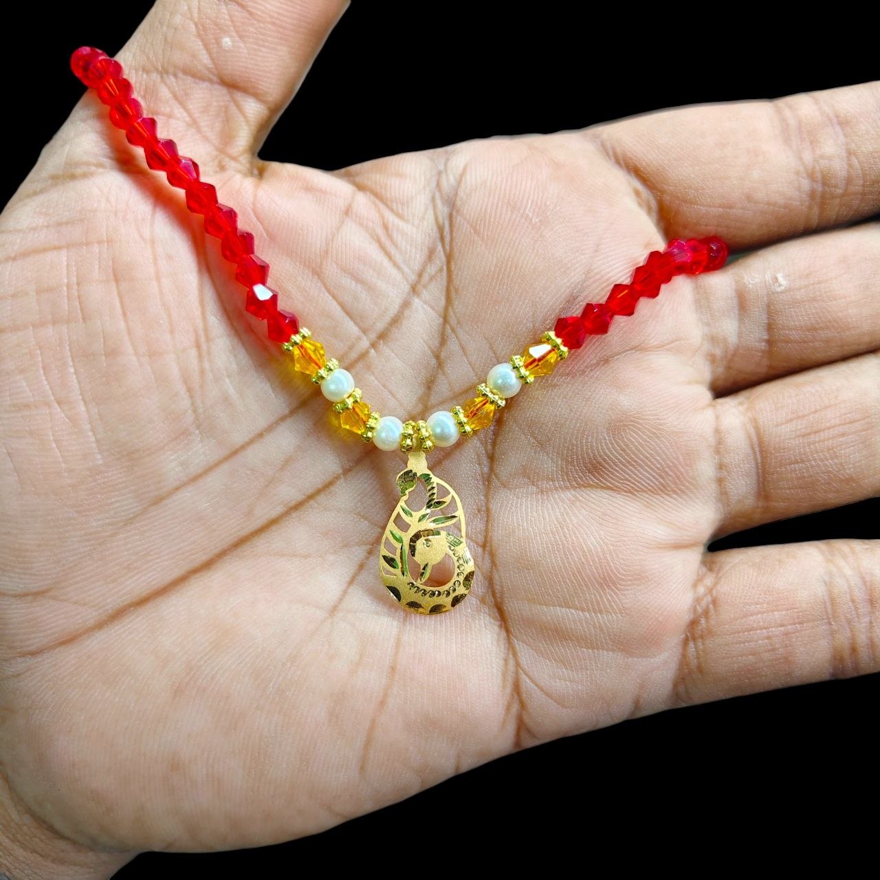 GOLD LOCKET- WGT: 0.280 GM APPROX BIS CERTIFIED HUID HALLMARK 22KT GOLD MOTI LOCKET 1 PIECE FOR WOMEN (WITH PUTI CHAIN).