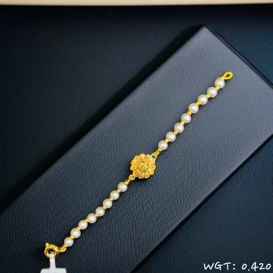 RAJLAXMI WGT: 0.420 GM APPROX HUID HALLMARK 916 22KT GOLD WRISTLET WITH PEARL CHAIN FOR BABY.