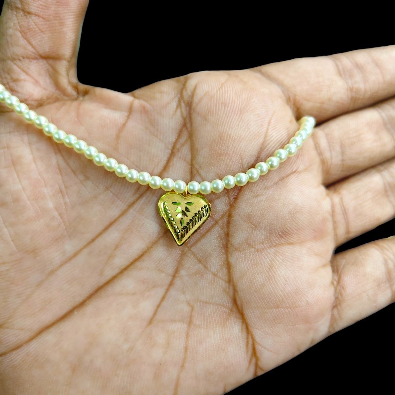 GOLD LOCKET- (WGT: 0.220 GM APPROX) BIS CERTIFIED HUID HALLMARK 9KT GOLD LOCKET 1 PIECE FOR WOMEN (WITH MOTI CHAIN).