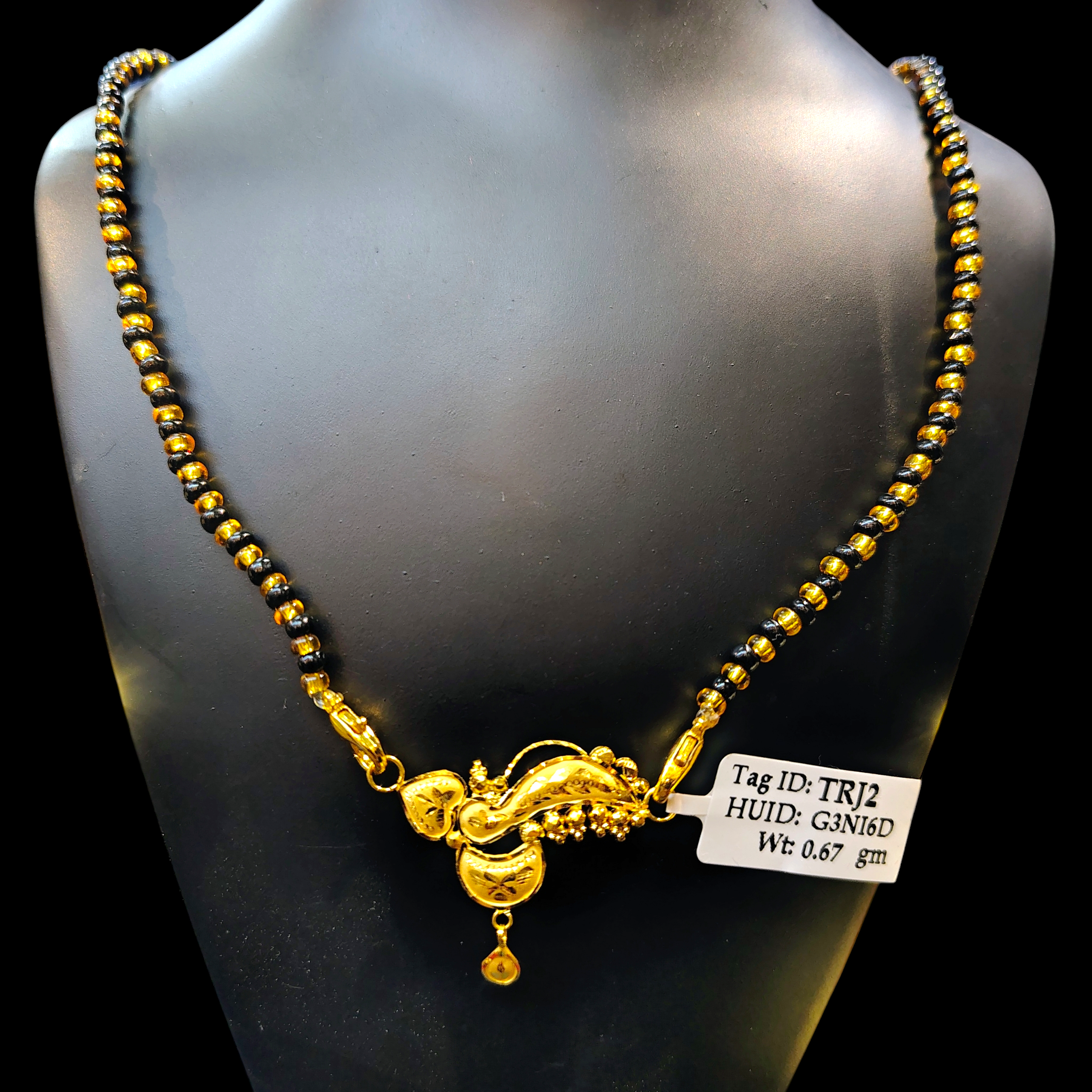 GOLD PENDANT- WGT: 0.670 GM APPROX 22KT HUID HALLMARK GOLD PENDANT MANGALSUTRA 1 PIECE WITH TASSEL.