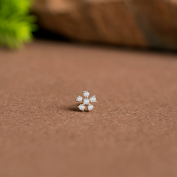 NOSEPIN- RAJLAXMI DIAMOND JEWELLERY - WGT: 0.215 GM - NATURAL DIAMOND (0.10 CENT) HUID HALLMARK 18KT DIAMOND NOSEPIN FOR WOMEN WITH CERTIFICATE OF AUTHENTICITY BY IGJI (DESIGN NO: M12082574).