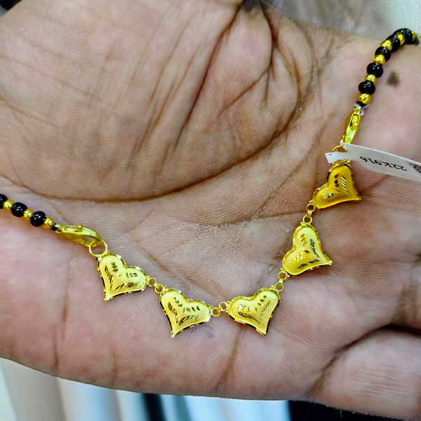 TRJ WGT: 0.970 GM APPROX 22KT HUID HALLMARK GOLD PENDANT MANGALSUTRA 1 PIECE WITH TASSEL.