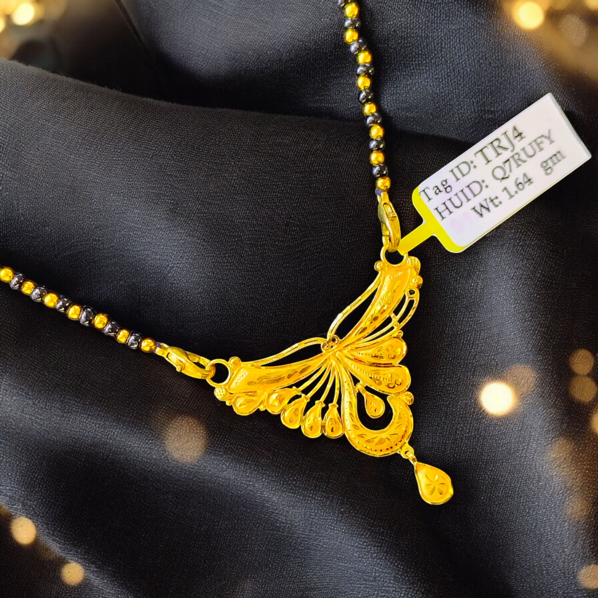 (GPM) TRJ WGT: 1.640 GM APPROX 22KT HUID HALLMARK GOLD PENDANT MANGALSUTRA 1 PIECE WITH TASSEL.